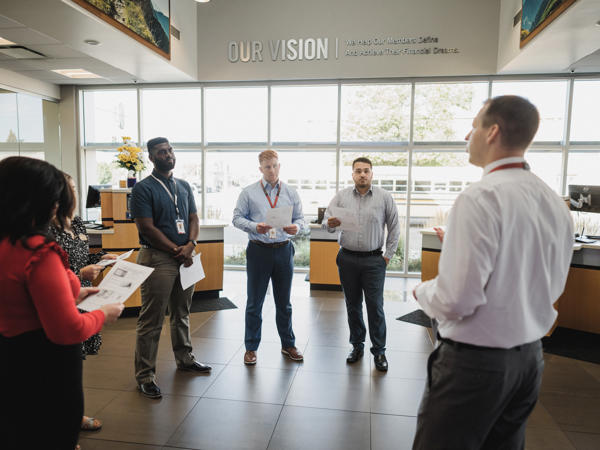 a group of people standing in a room