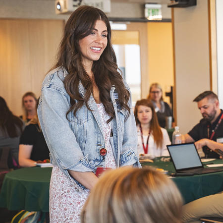 a person standing in front of a group of people