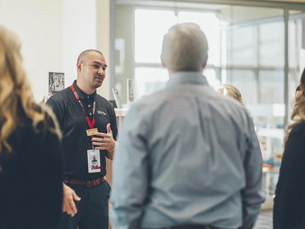 a person talking to a group of people