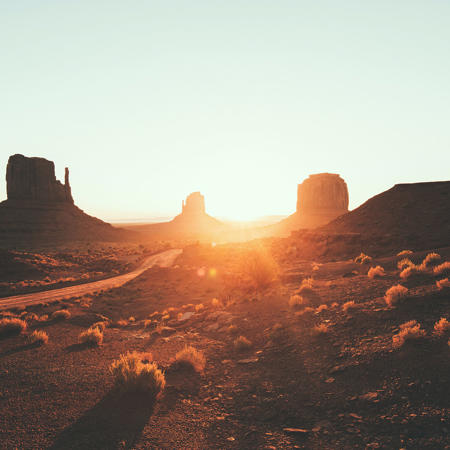 a desert landscape with tall rock formations
