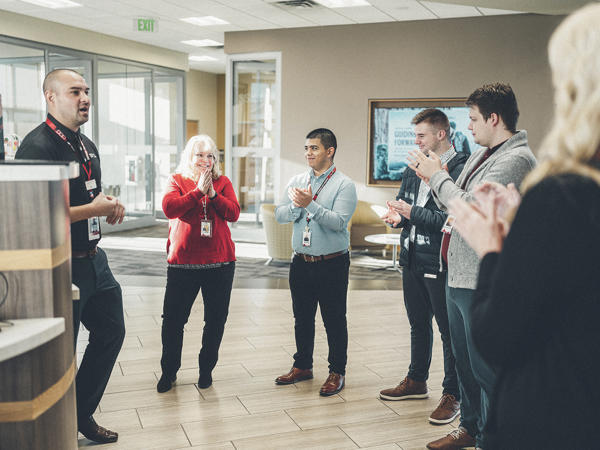 a group of people clapping